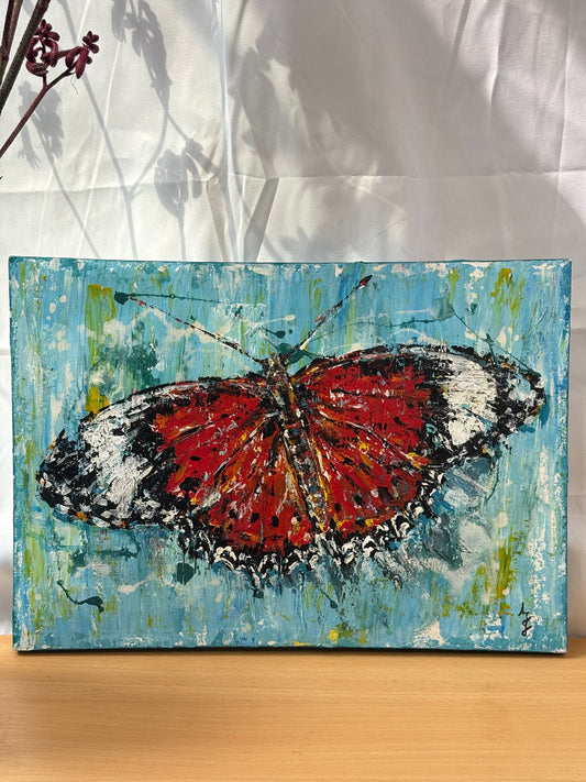 Painting of a butterfly on a textured blue background
